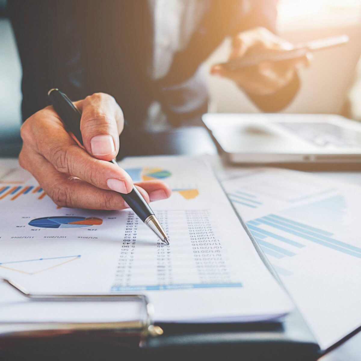 paper-job-office-teamwork-business-analyst Business concept. Business people discussing the charts and graphs showing the results of their successful teamwork.